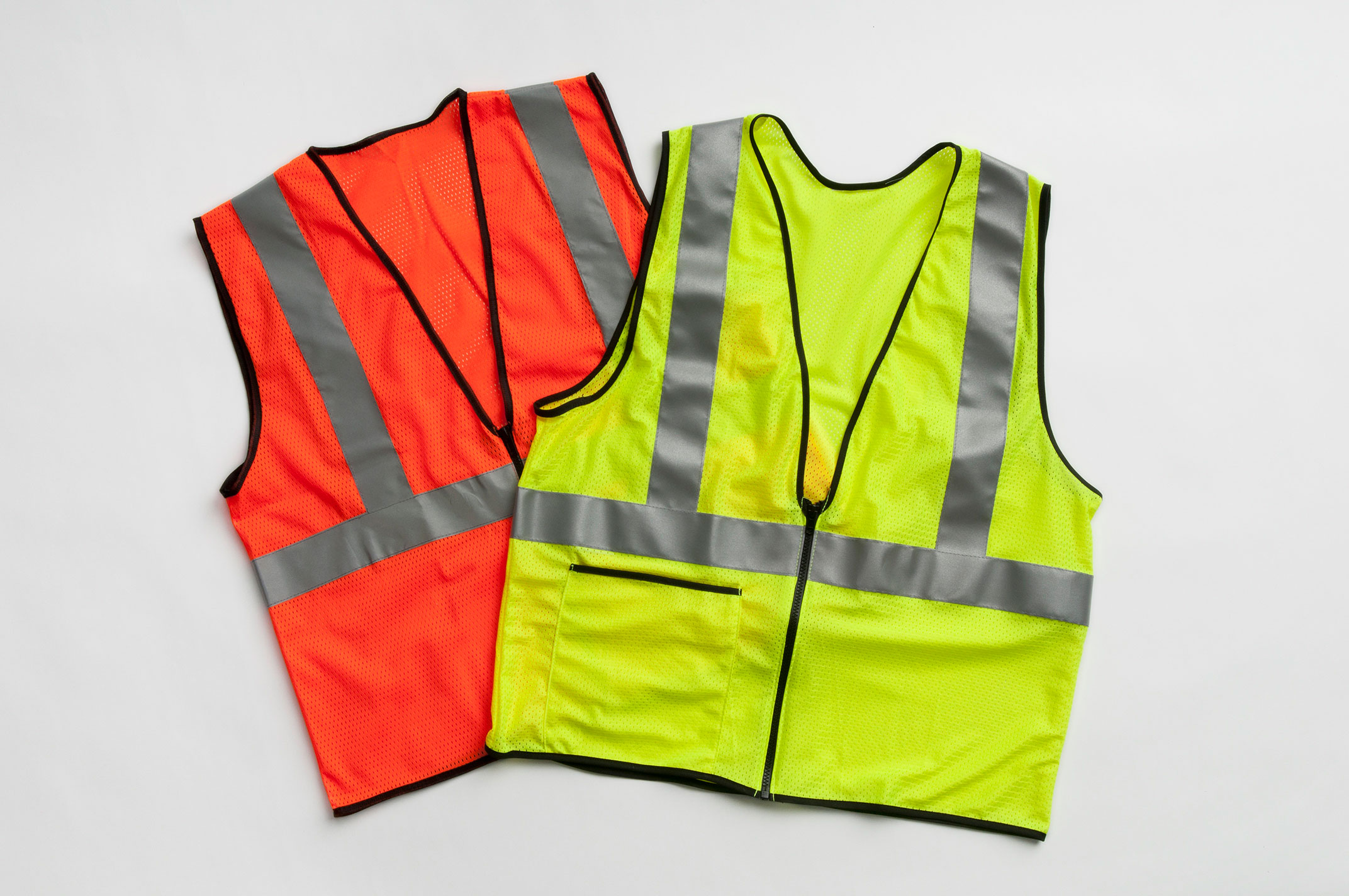 a display of safety vest in orange and yellow